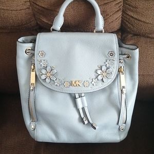 Michael kors convertible backpack with flowers.